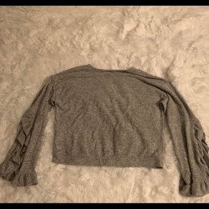 Long sleeve flared shirt.